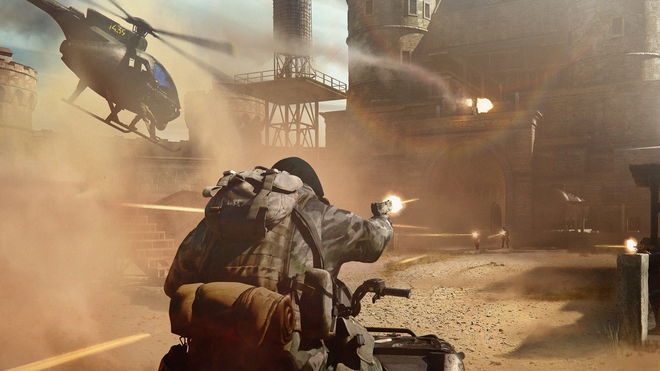 Warzone Mobile player riding ATV while firing gun with helicopter in background