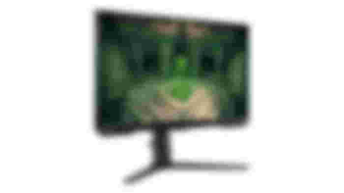 Samsung Odyssey G4 product image of a curved black monitor with a green crystal in a dark room on the display.
