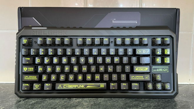 Melgeek Cyber01 keyboard in front of the box and a tiled wall