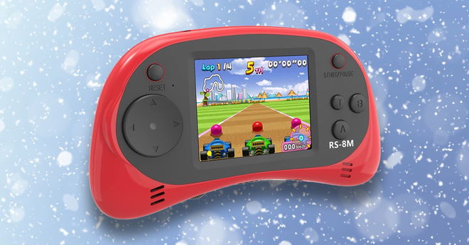A red handheld games console in front of a snowy gradient blue background.