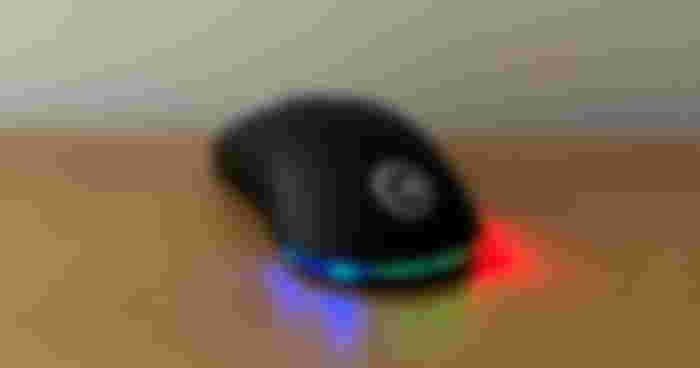 A black gaming mouse with Chillblast branding in grey on top and multicolored RGB lights beneath it.