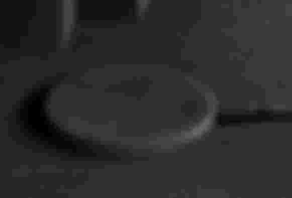 Native Union Drop product image of a black wireless charging pad.