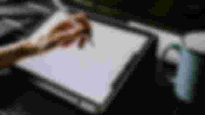 Woman's hands drawing on an iPad