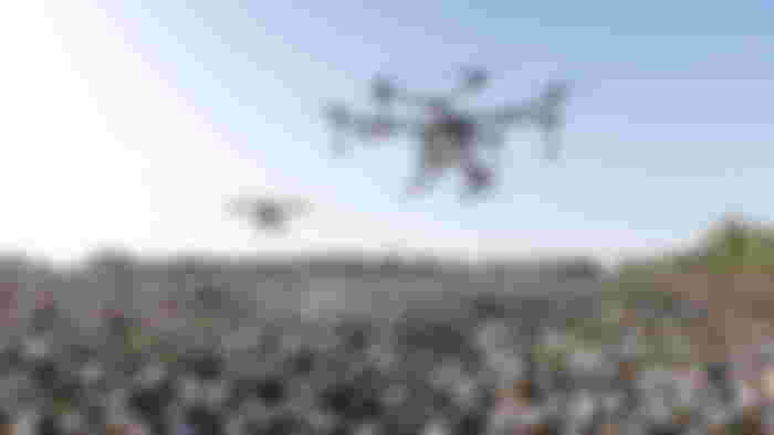 Two delivery drones flying