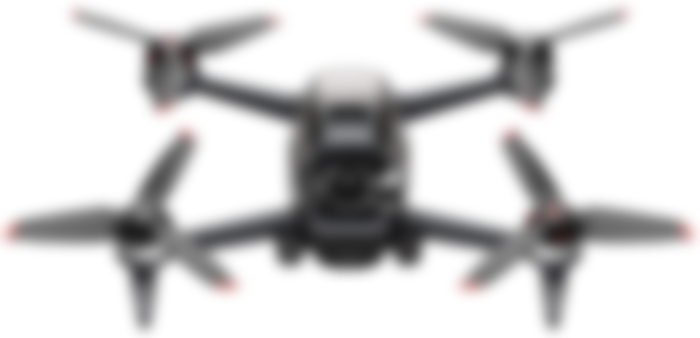 DJI FPV product image of a black drone with orange tips on the four propellers.