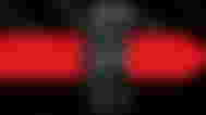 The AMD Radeon RX 7600 XT GPU on a black and red background gradient