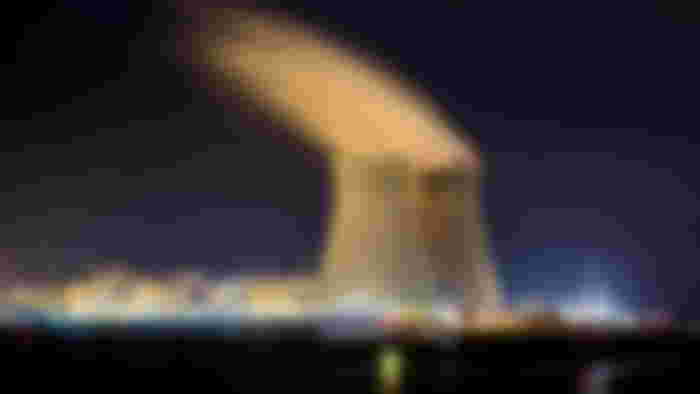 Nuclear power plant at night.
