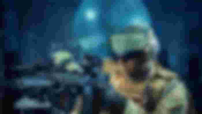 Military personnel using AI for training.