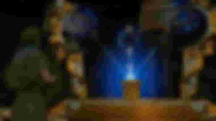 Nightingale player stood in front of gold and blue altar