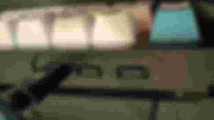 A close-up of the back of a black keyboard with a switch to swap between Windows and Mac modes.