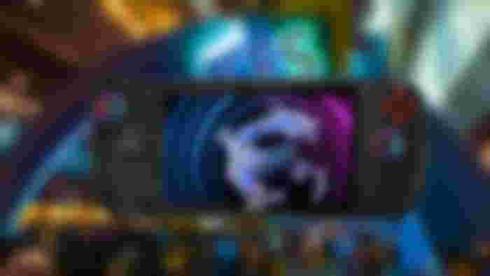 MSI Claw in front of a blurred CES image