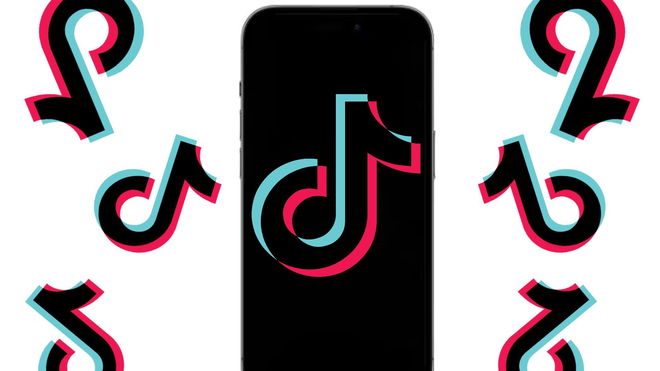 A black screen on an iPhone 15 Pro Max with the TikTok logo on it and a bunch of TikTok logos surrounding it