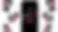 A black screen on an iPhone 15 Pro Max with the TikTok logo on it and a bunch of TikTok logos surrounding it