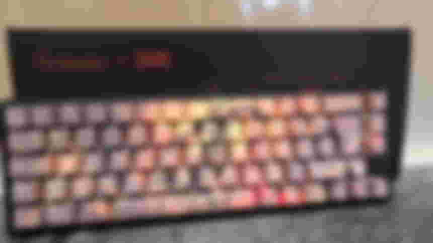 Ducky x DOOM One 3 SF keyboard lying at an angle against the box