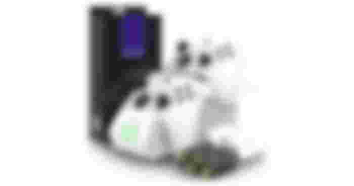 Fosmon Dual 2 Max product image of two white Xbox controllers connected to a charging stand featuring green lights. The stand placed next to the box and batteries.