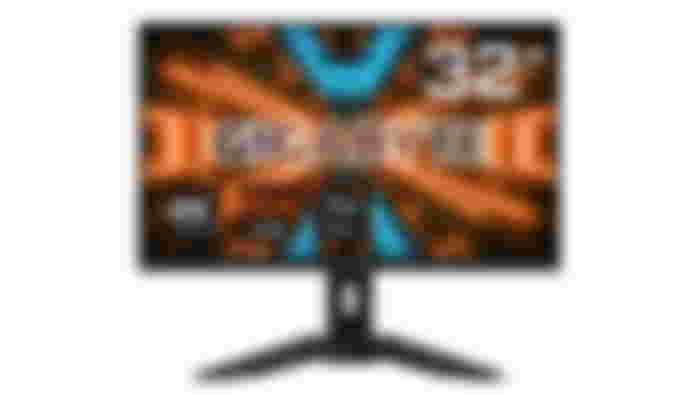 Gigabyte M32U product image of a black monitor featuring white Gigabyte branding in front of orange and blue lighting in the background on the display.