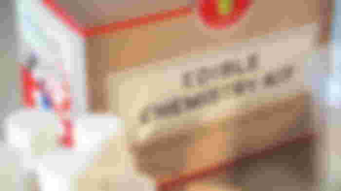 A brown box with "Edible Chemistry Kit" branding in black on the front.