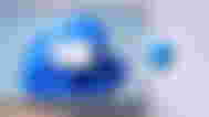 Windows 11 on a laptop with a graphic of a blue shield inside a grey square next to it.