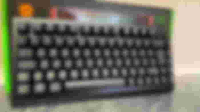 Razer Blackwidow V4 75% in front of a tiled wall