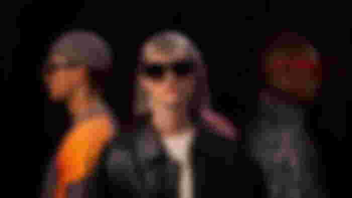three people wearing XRearl Air 2 Ultra AR glasses