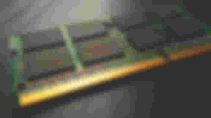 Close-up of a green, black, and gold RAM.