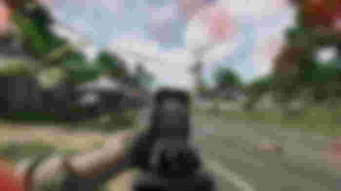 Firing a gun while aiming down its sight in Gray Zone Warfare.