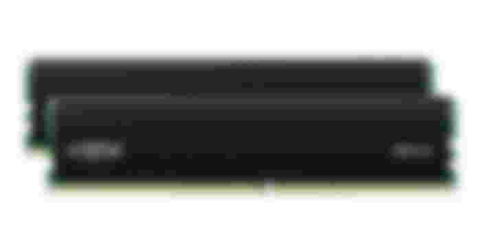 Crucial Pro RAM 32GB Kit product image of two black RAM cards with green and gold internal components.