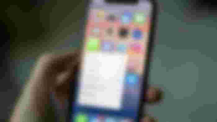 iPhone homescreen with the Whatsapp app options.