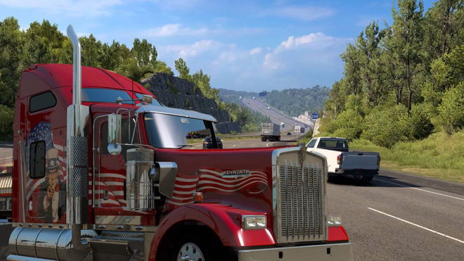 A large red truck next to the Missouri interstate