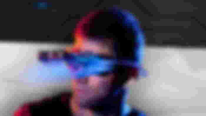 A person wearing goggles with gadgets all over them.