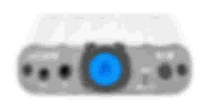 iFi Audio xCAN product image of a white portable amp with a blue button on the front.