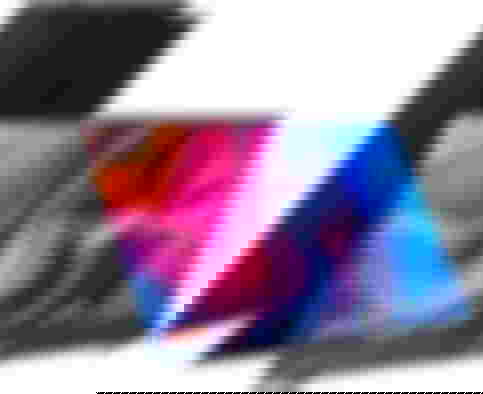 ASUS ProArt Display product image of a foldable black display with a wavy orange, pink, purple, and blue pattern on the display.