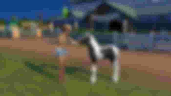 The Sims 4 Horse Ranch DLC feeding a foal