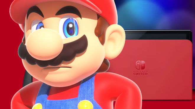 Mario looking sternly next to the red Nintendo Switch OLED