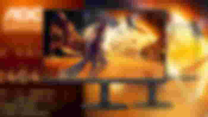 Close up of the new AOC 24G4X monitor in front of a blurred press image