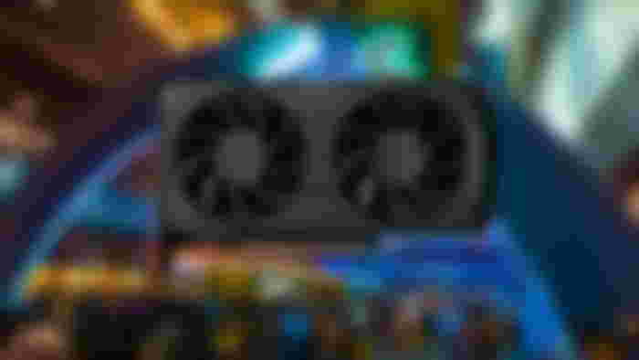 AMD RX 7600 XT in front of a blurred CES image