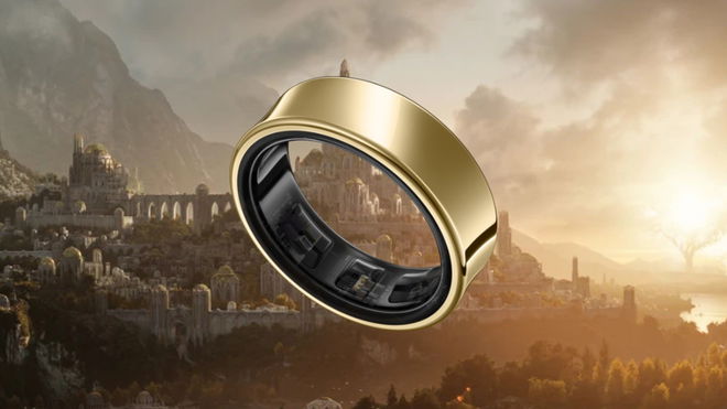 A gold Samsung Galaxy Ring in front of a wallpaper of the Lord of the Rings Amazon TV series