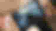 Someone playing Forza on an AYANEO Next Lite handheld