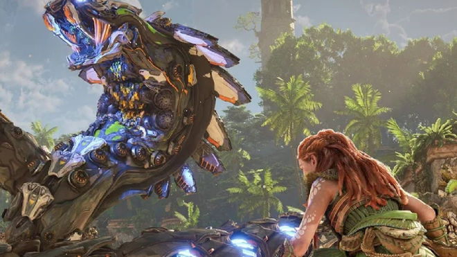 Aloy crouched looking at snake-like machine in Horizon Forbidden West