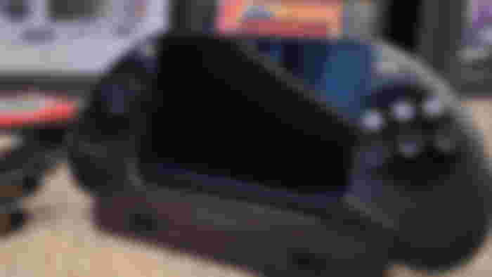 The Hyperkin Mega95 SEGA Genesis handheld in the USB-C dock playing Comix Zone