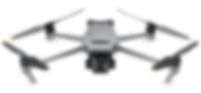 DJI Mavic 3 product image of a grey drone with four black propellers with orange tips.