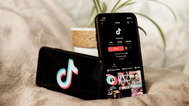 Tiktok app and logo on an iPhone.