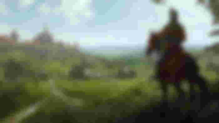 Manor Lords horses: A knight riding on horseback while overlooking a settlement in the distance.