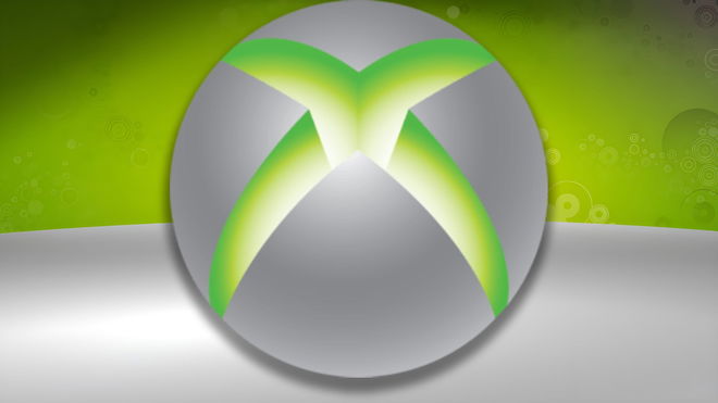 The Xbox 360 logo towering over a green and grey wallpaper background 