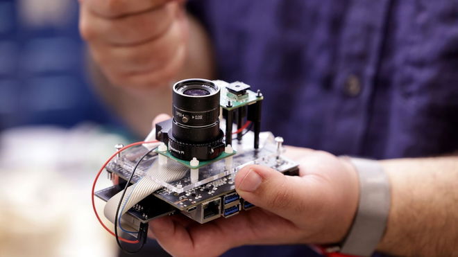 PrivacyLens in the hand of an engineer from University of Michigan.